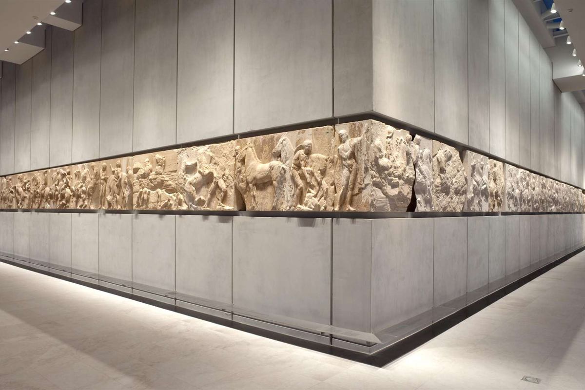 Acropolis guided tour with Acropolis Museum: the marble Parthenon frieze with horsemen and figures set along the walls of the Parthenon Gallery inside the Acropolis Museum